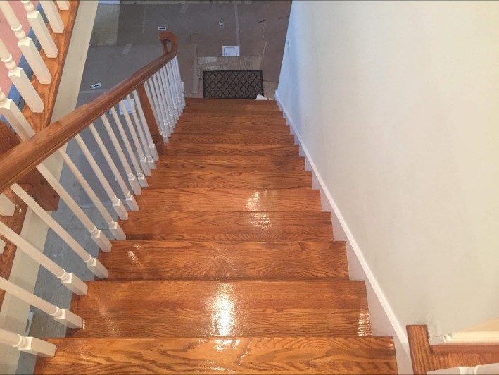 Refinished hardwood staircase with finished steps