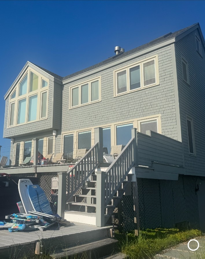 Coastal home exterior with painted entry stairs