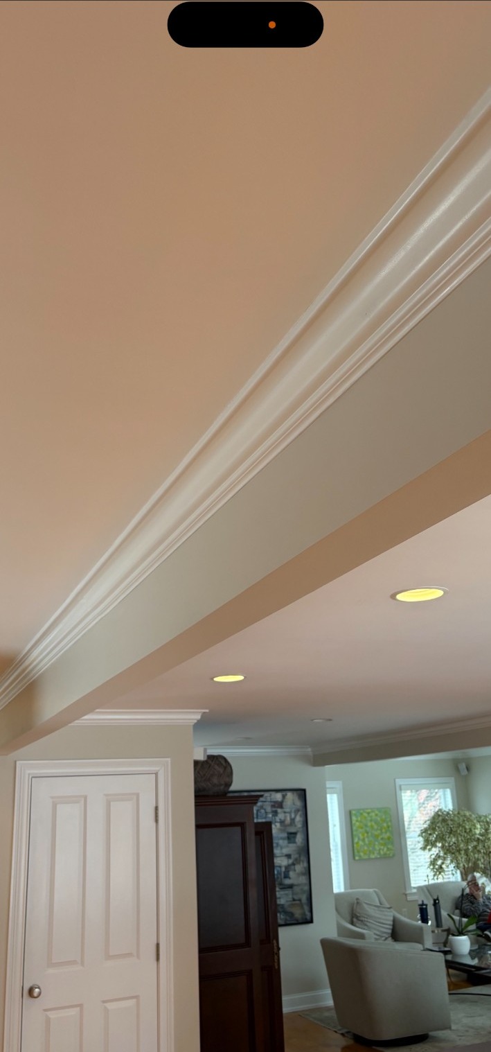 Same ceiling beam finished with crown molding detail