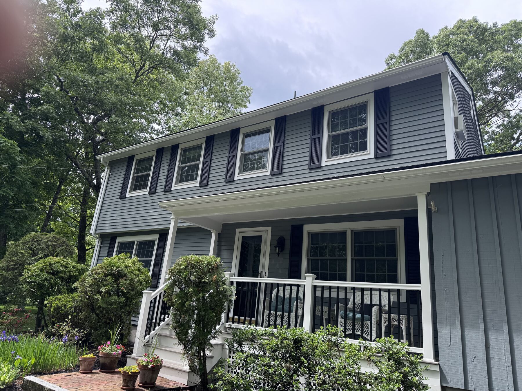 Gray two-story house exterior painted by Harbour Painting and Restoration