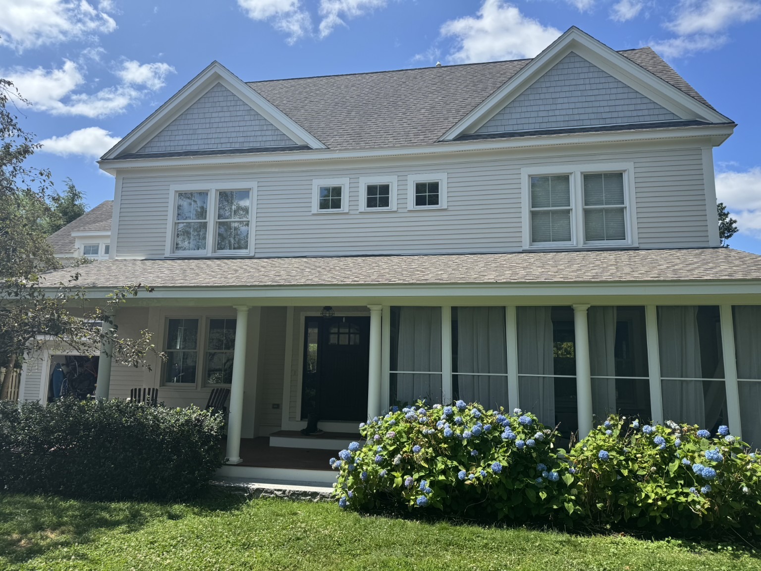 Gray coastal home exterior painted by Harbour Painting and Restoration
