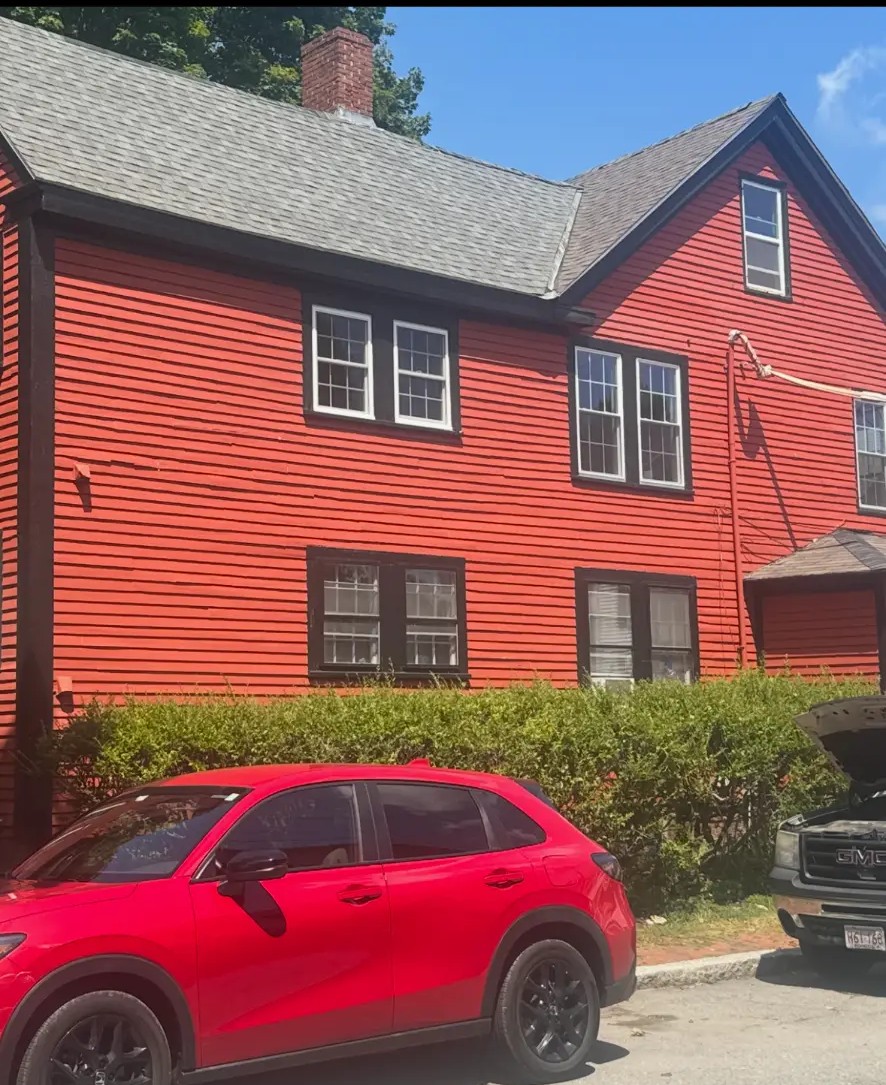 Red clapboard home exterior repainted by Harbour Painting and Restoration